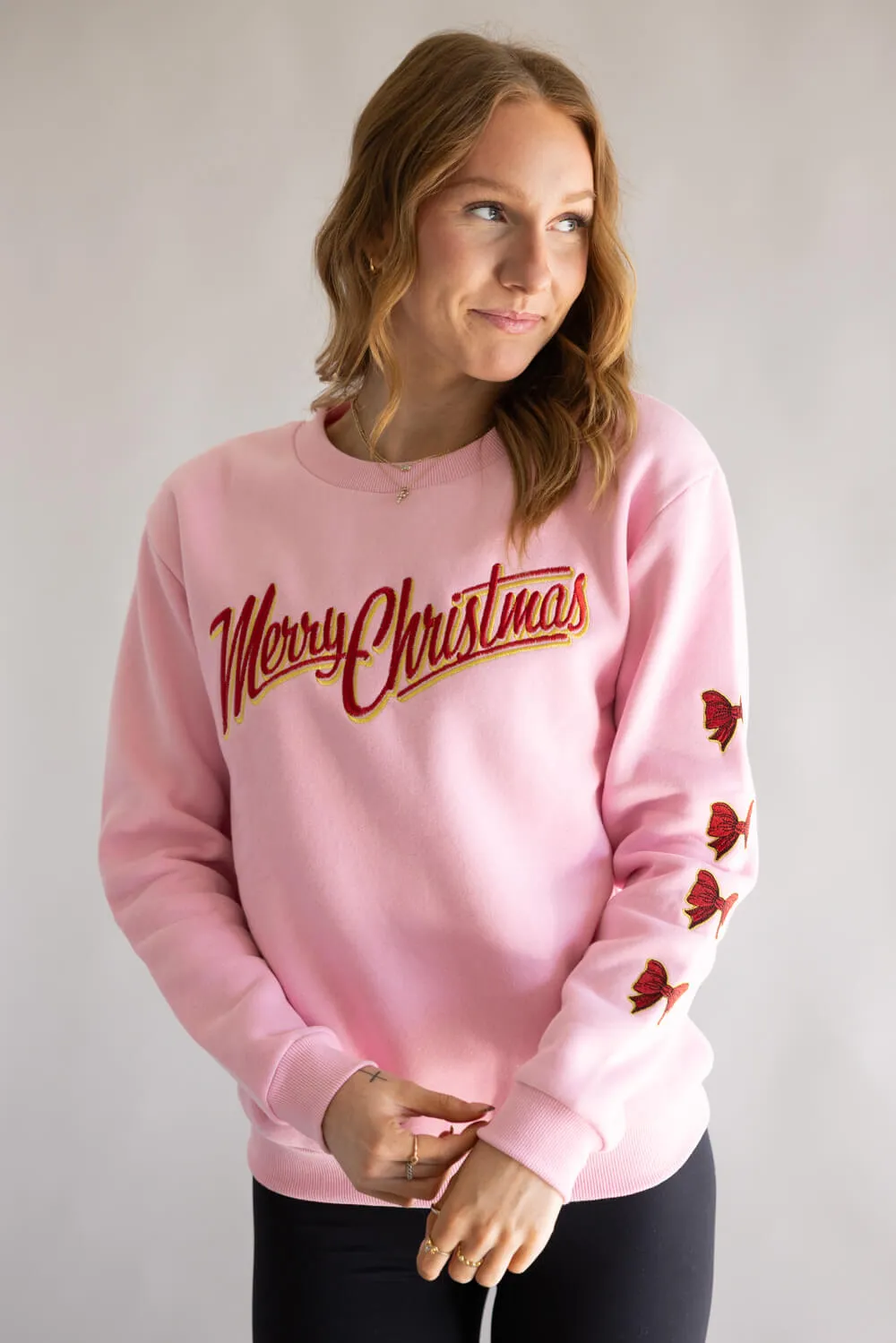 Simply Southern Embroidered Holiday Bow Sweatshirt for Women in Pink | PP-0225-CRW-DILARA-MERRY sold by Glik’s