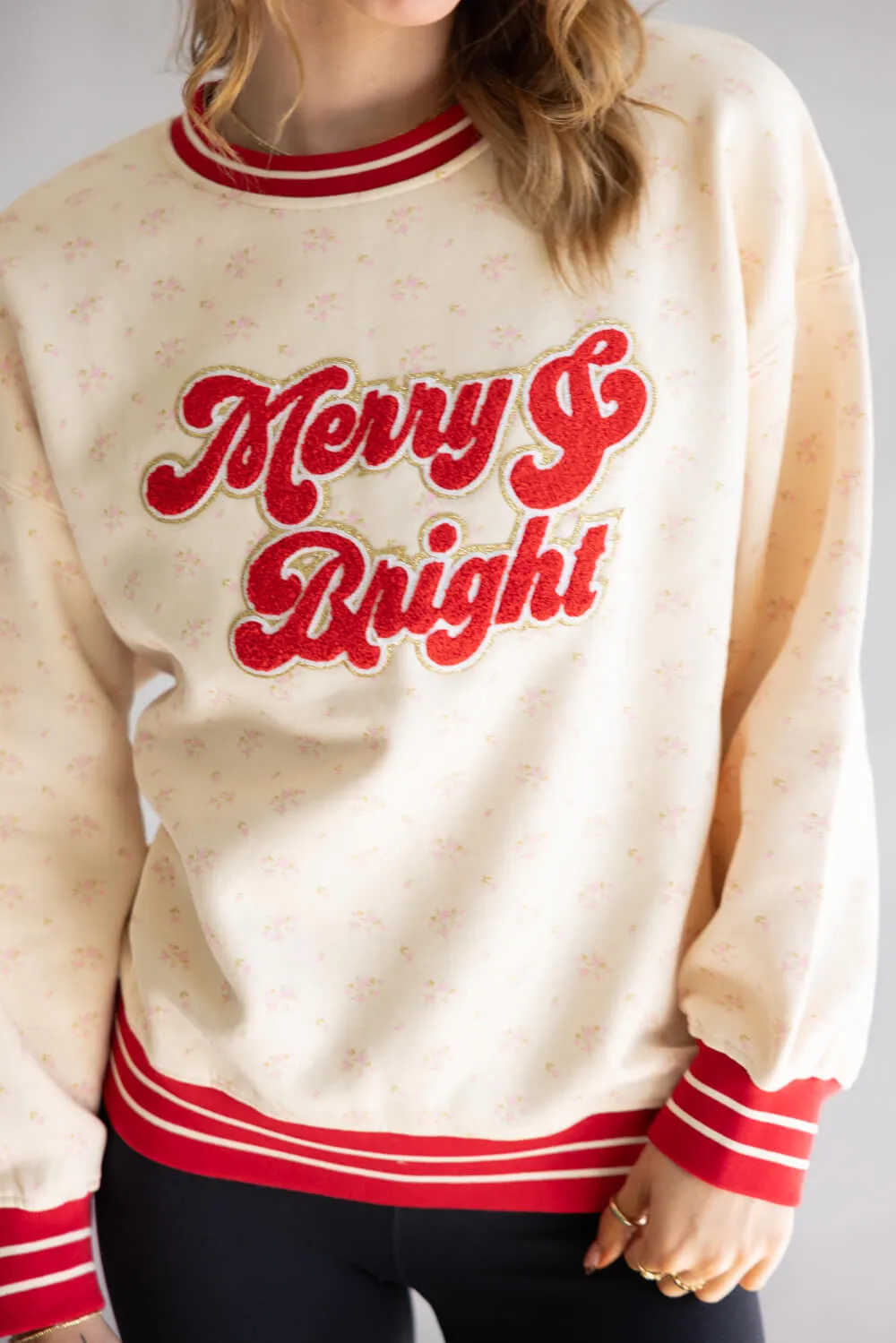 Simply Southern Merry & Bright Varsity Crew Sweatshirt for Women in Cream | PP-0225-CRW-VARSITY-HLD-MRY sold by Glik’s