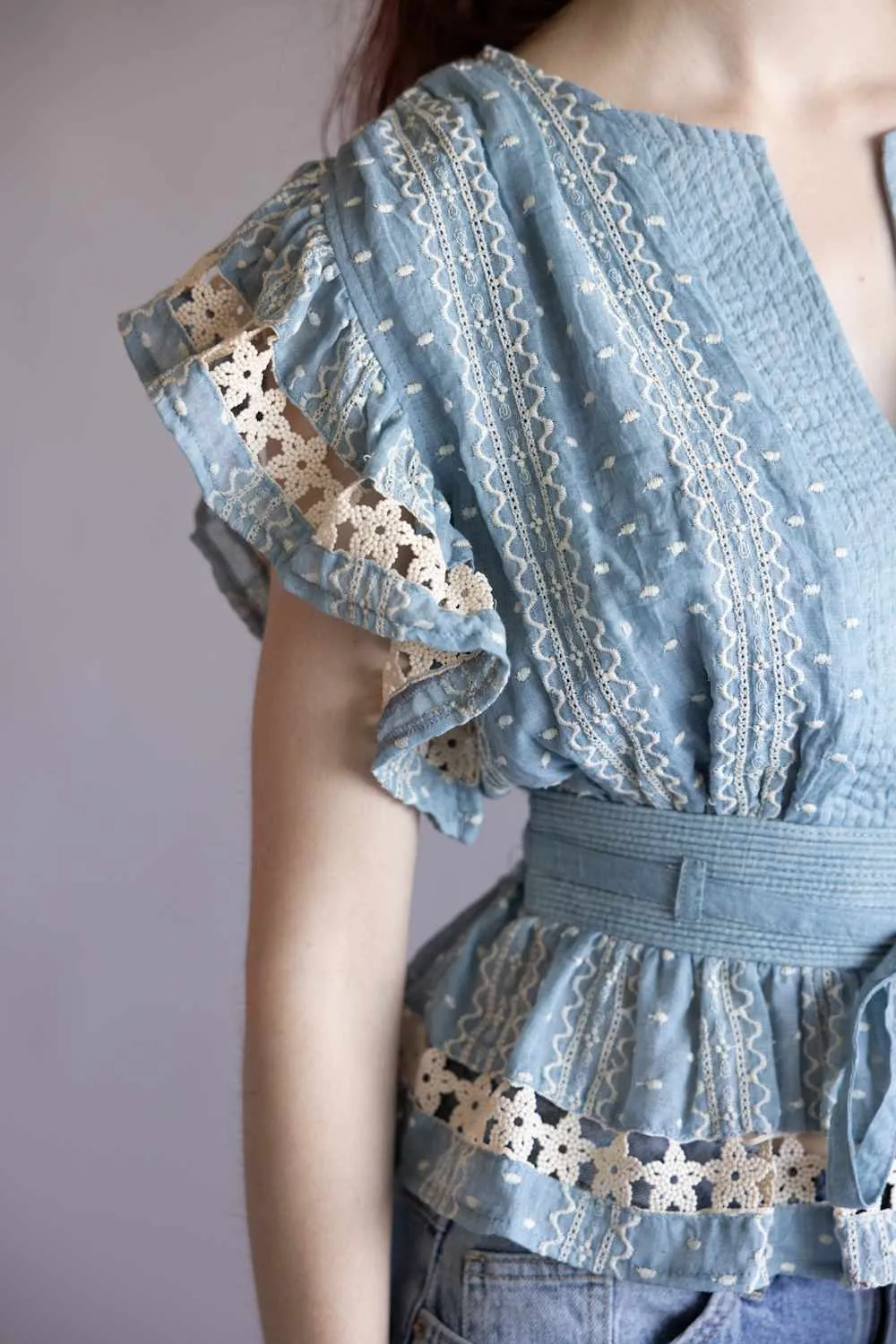 Embroidered Flutter Sleeve Peplum Top for Women in Chambray | T-50742-H-CHM sold by Glik’s product image thumbnail 2