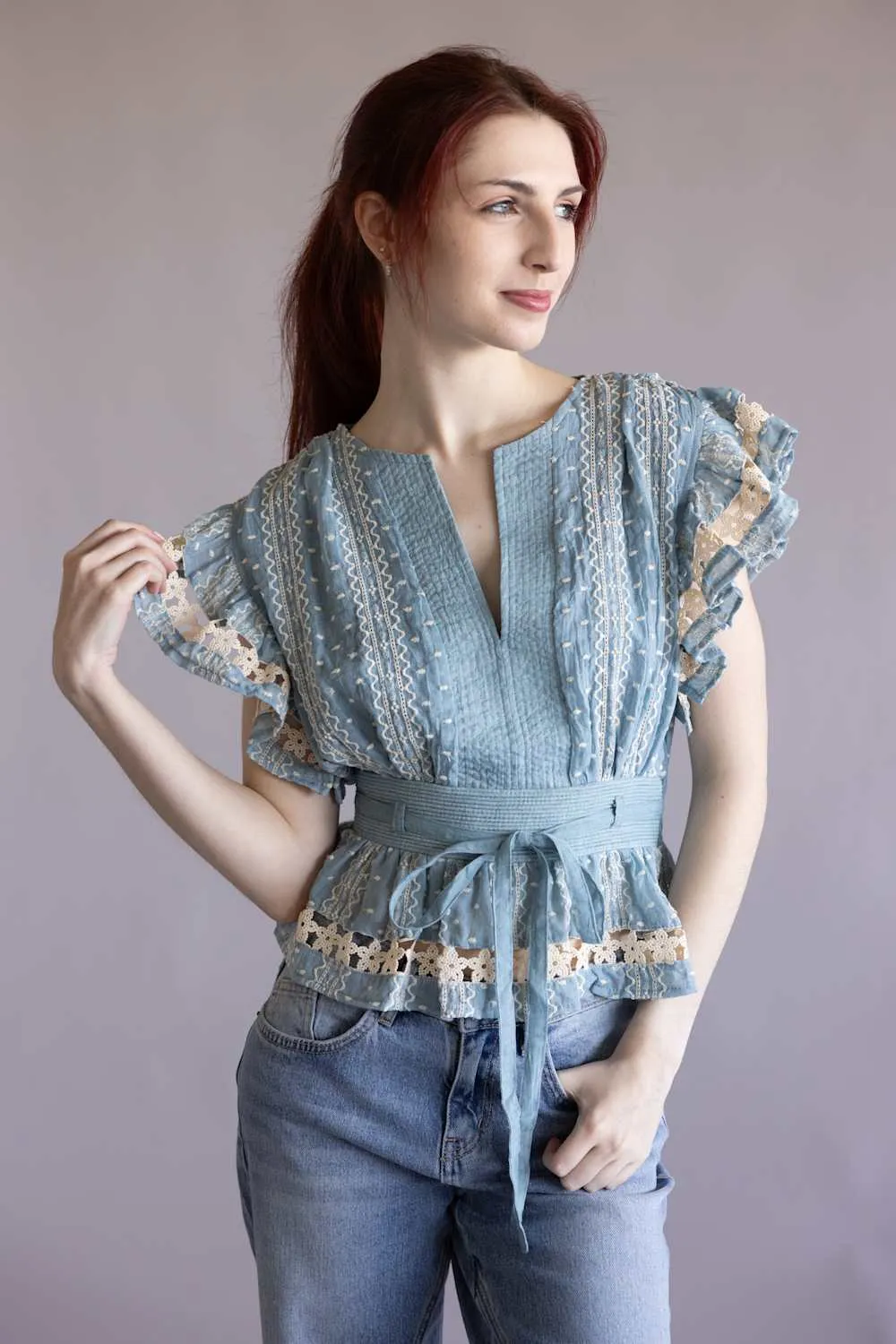 Embroidered Flutter Sleeve Peplum Top for Women in Chambray | T-50742-H-CHM sold by Glik’s