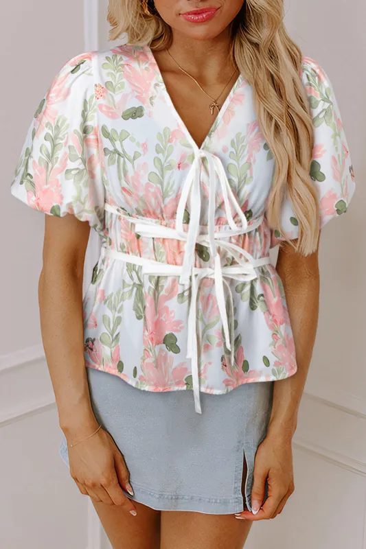 Pink Floral Puff Sleeve V Neck Tied Front Peplum Blouse sold by eAura