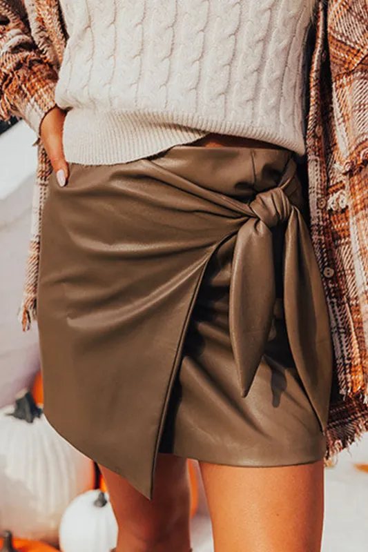 Coffee Bowknot Faux Leather Mini Skirt sold by eAura