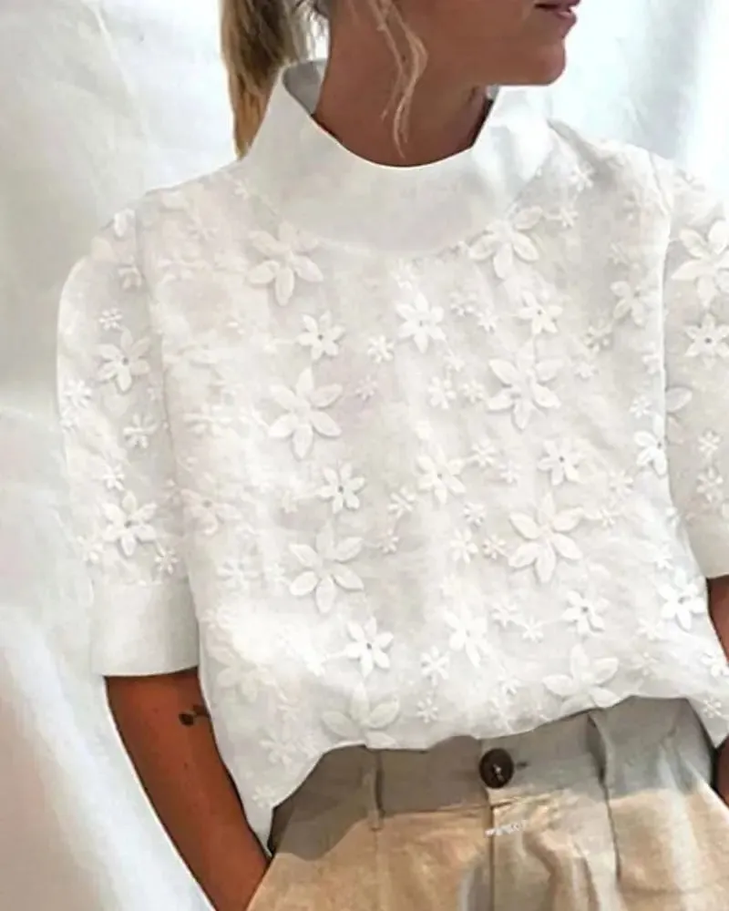 Léana™ embroidered blouse with high collar sold by Modeberg Bern