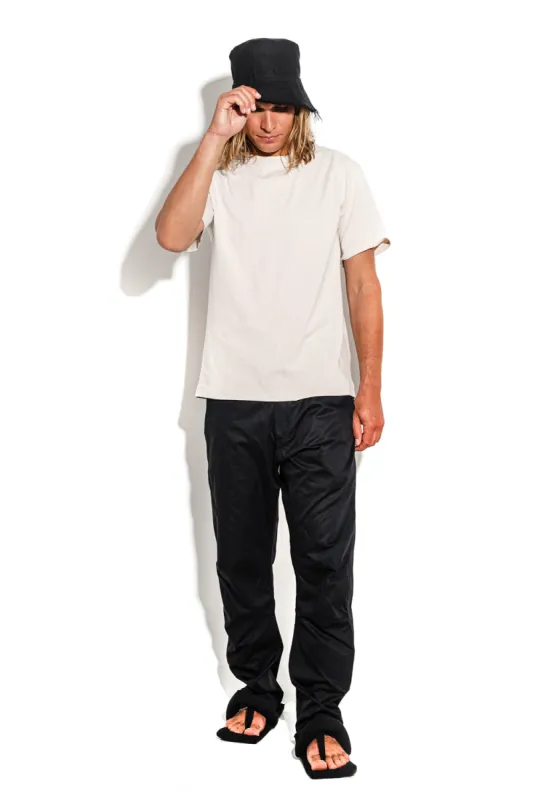 Beige T-shirt with a geometric seam sold by MDNT:45