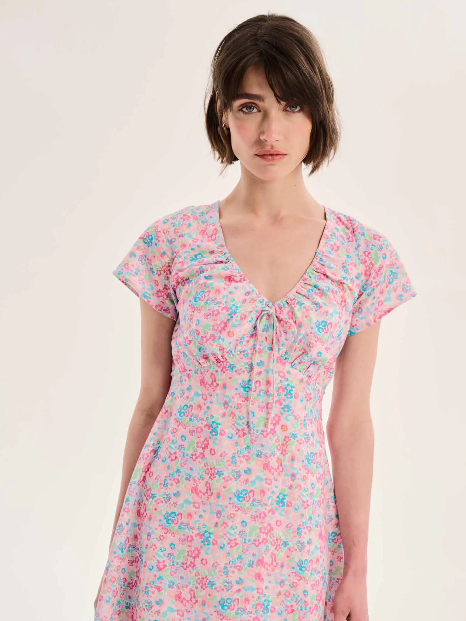 Dotty V Neck Ruched Mini Dress in Floral Print sold by Omnes product image thumbnail 3