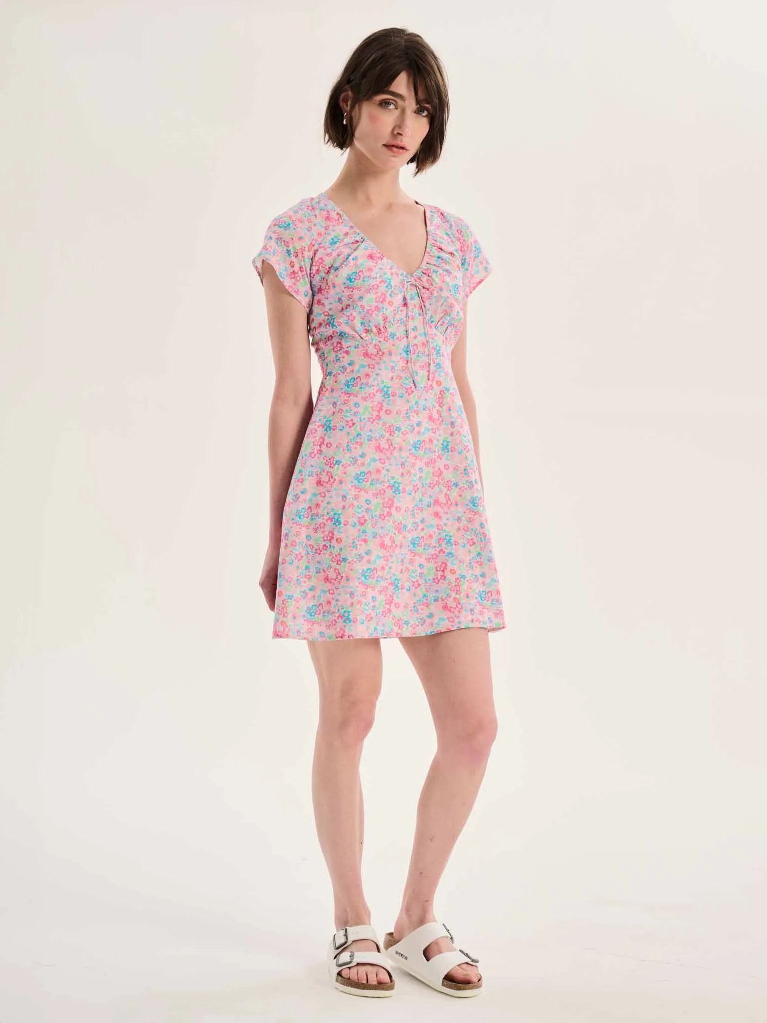 Dotty V Neck Ruched Mini Dress in Floral Print sold by Omnes product image thumbnail 2