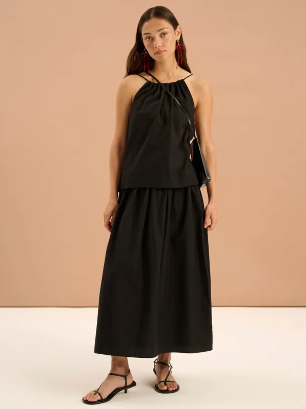 Darcie Drop Waist Full Midi Skirt in Black sold by Omnes