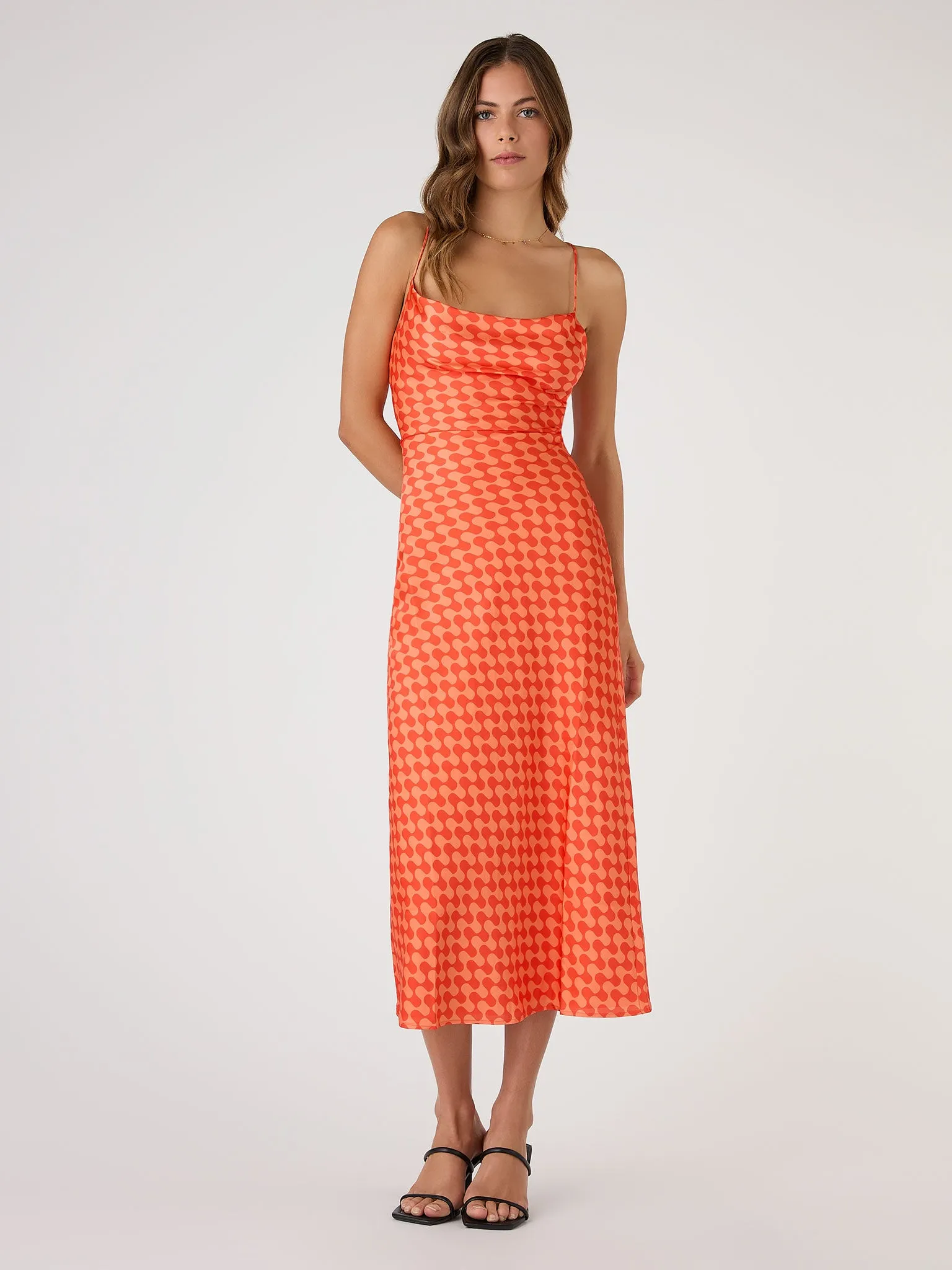 Riviera Midi Dress in Wavy Orange Print sold by Omnes