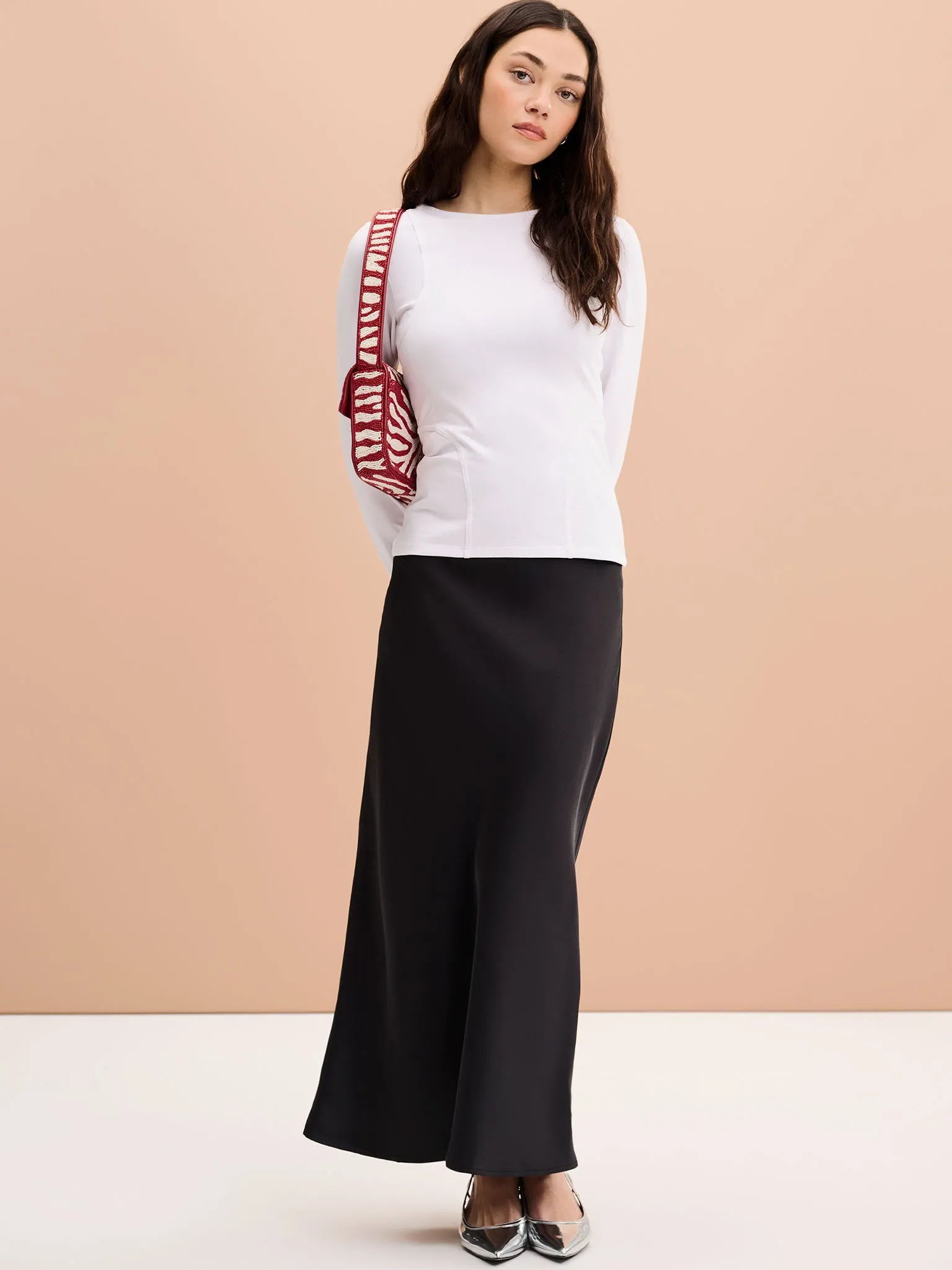 Zora Jersey Top in White sold by Omnes