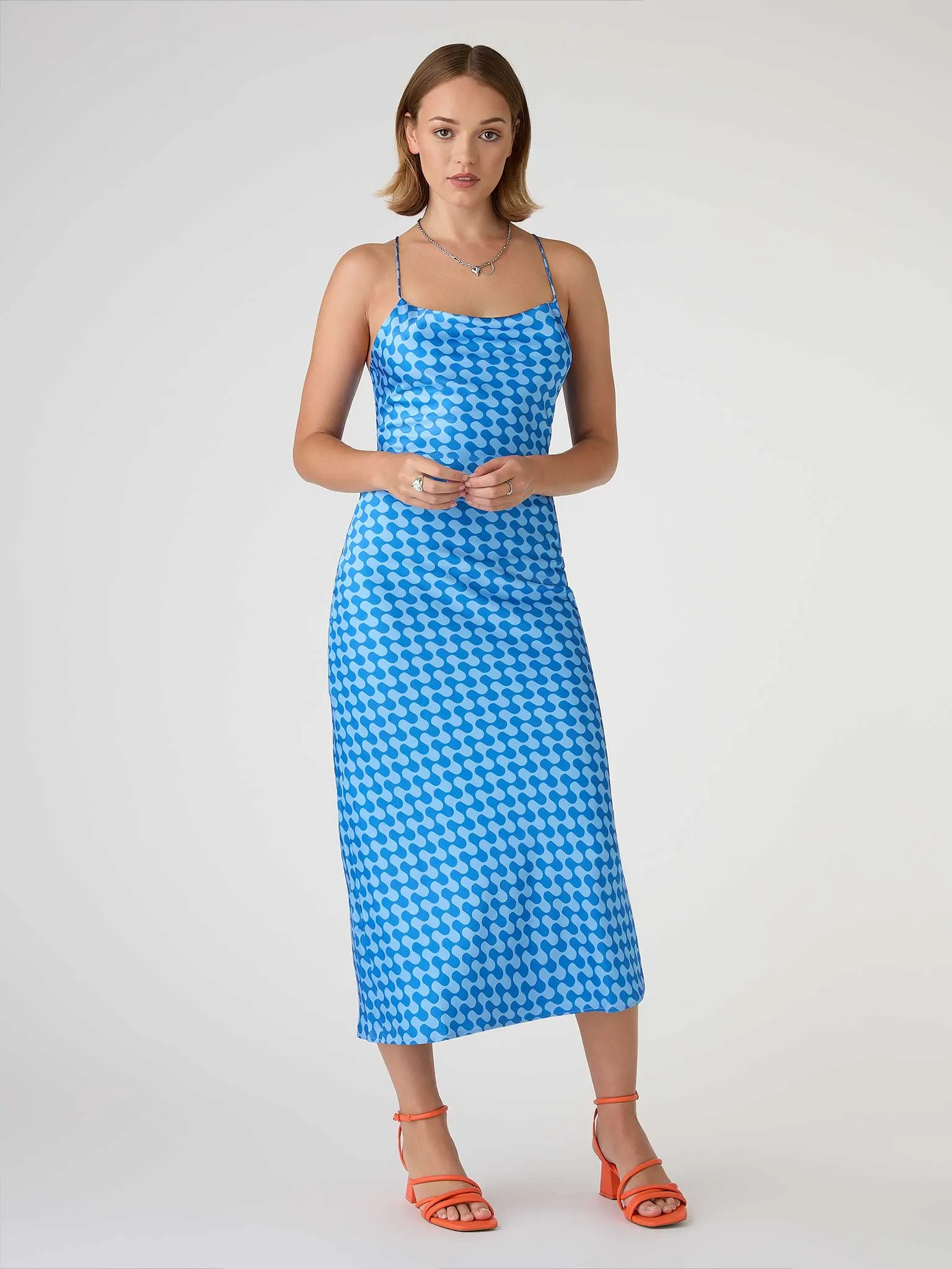Riviera Midi Dress in Wavy Blue Print sold by Omnes