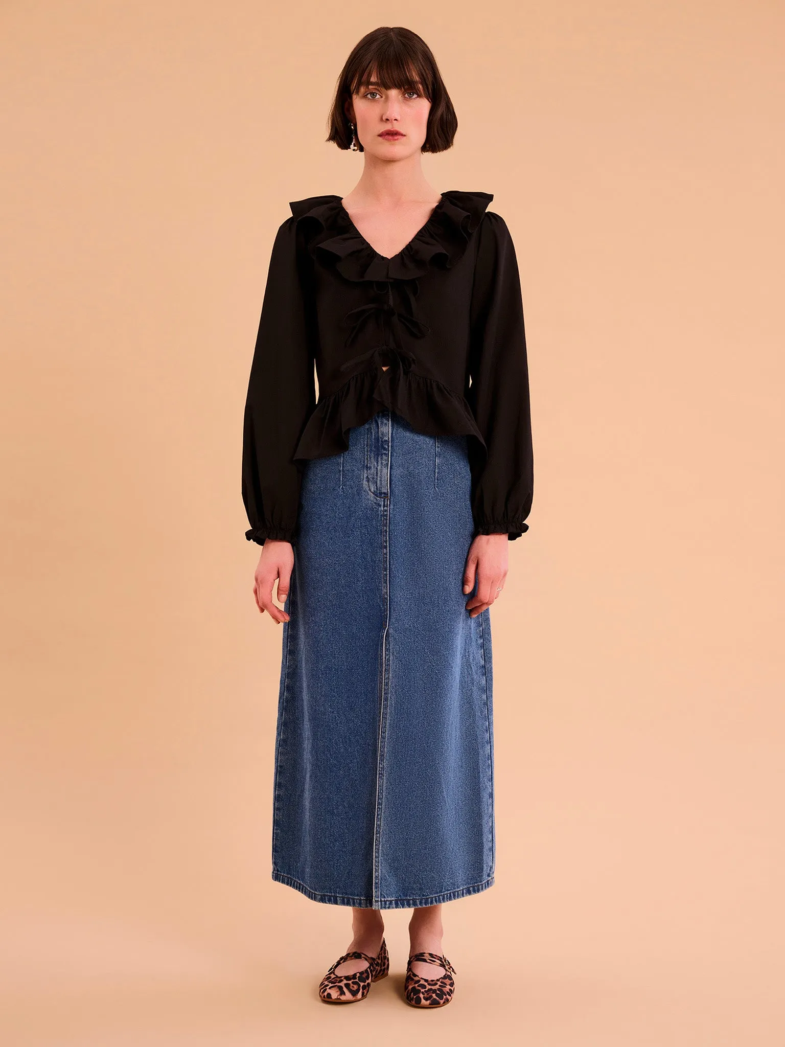 Selena Frill Blouse in Black sold by Omnes