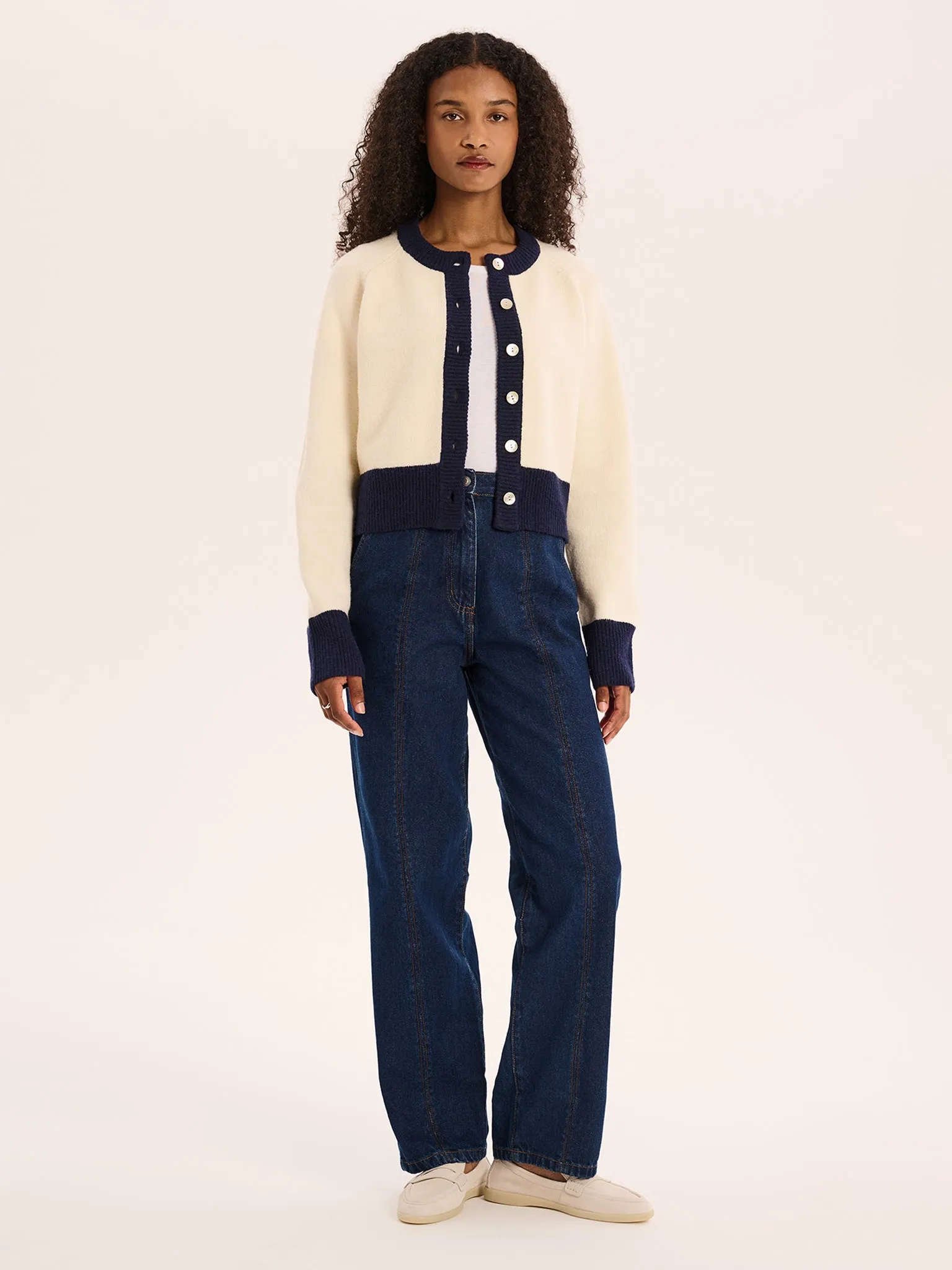 August Fluffy Cardigan in Cream sold by Omnes