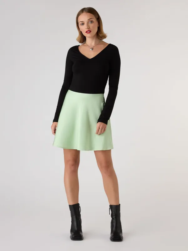 Jeanne Mini Satin Skirt in Green sold by Omnes