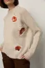 Lady Leaves Sweater sold by Larroude