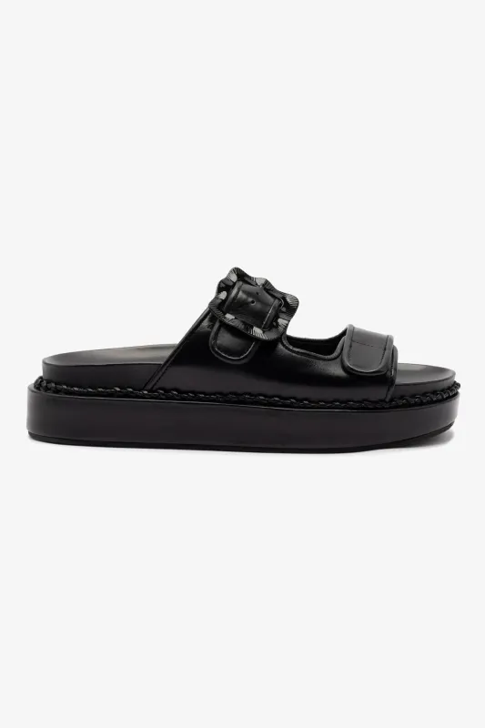 Maui Slide In Black Leather sold by Larroude