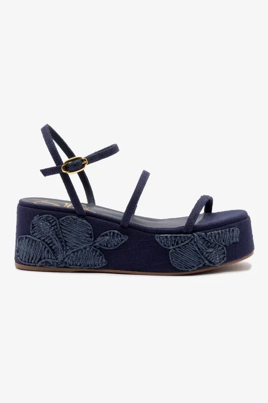 Gio Flatform In Navy Raffia and Hibiscus Embroidery sold by Larroude