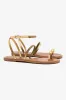 Biarritz Flat Sandal In Gold Metallic Leather sold by Larroude