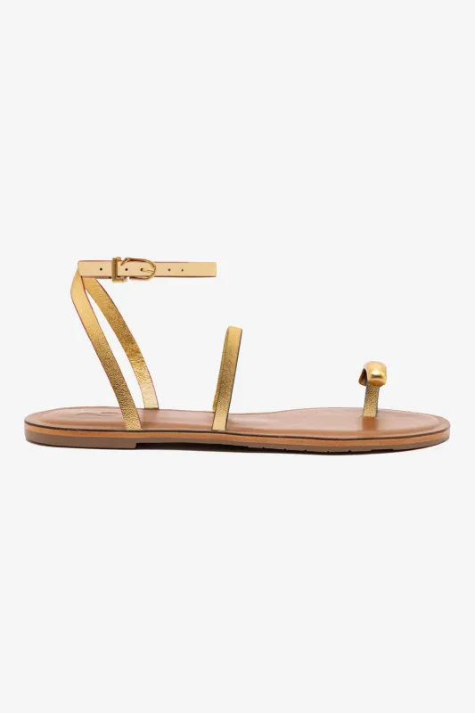 Biarritz Flat Sandal In Gold Metallic Leather sold by Larroude