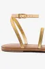 Biarritz Flat Sandal In Gold Metallic Leather sold by Larroude