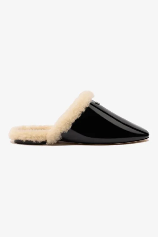 Venice Flat Mule In Black Patent Leather And Natural Shearling sold by Larroude