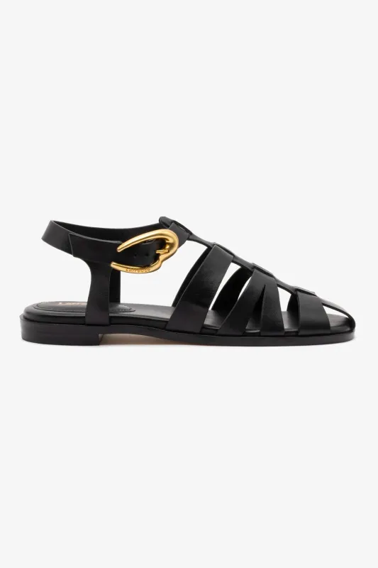 Stevie Flat Sandal In Black Leather sold by Larroude