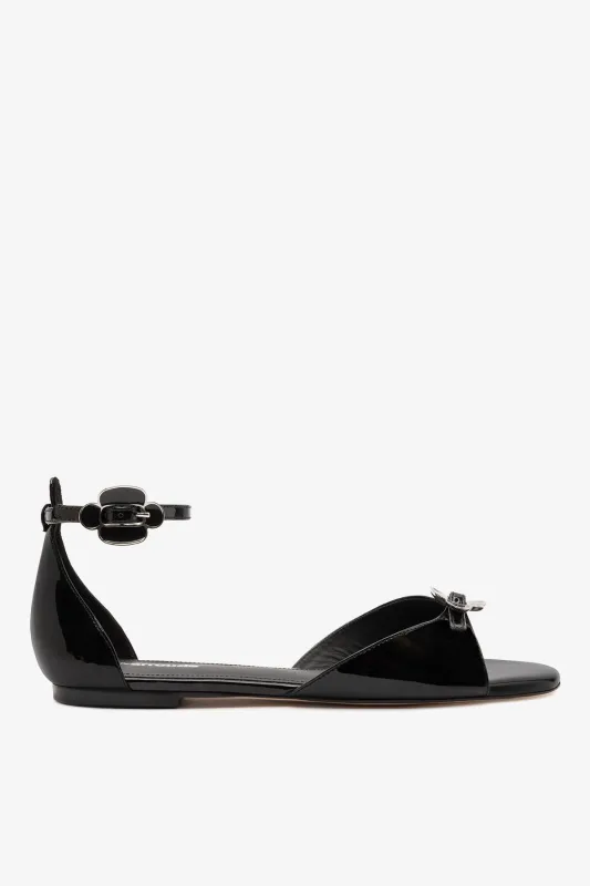 Tinx Flat Ankle Sandal In Black Soft Patent sold by Larroude