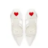 Brooks Pump In White Patent Leather sold by Larroude