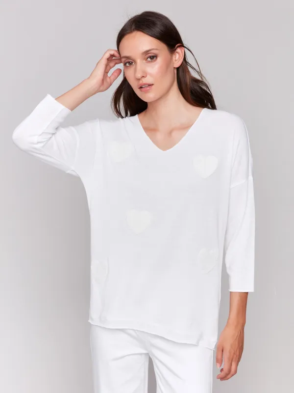 V-Neck Knit Top With Heart Appliqué - White sold by Charlie B