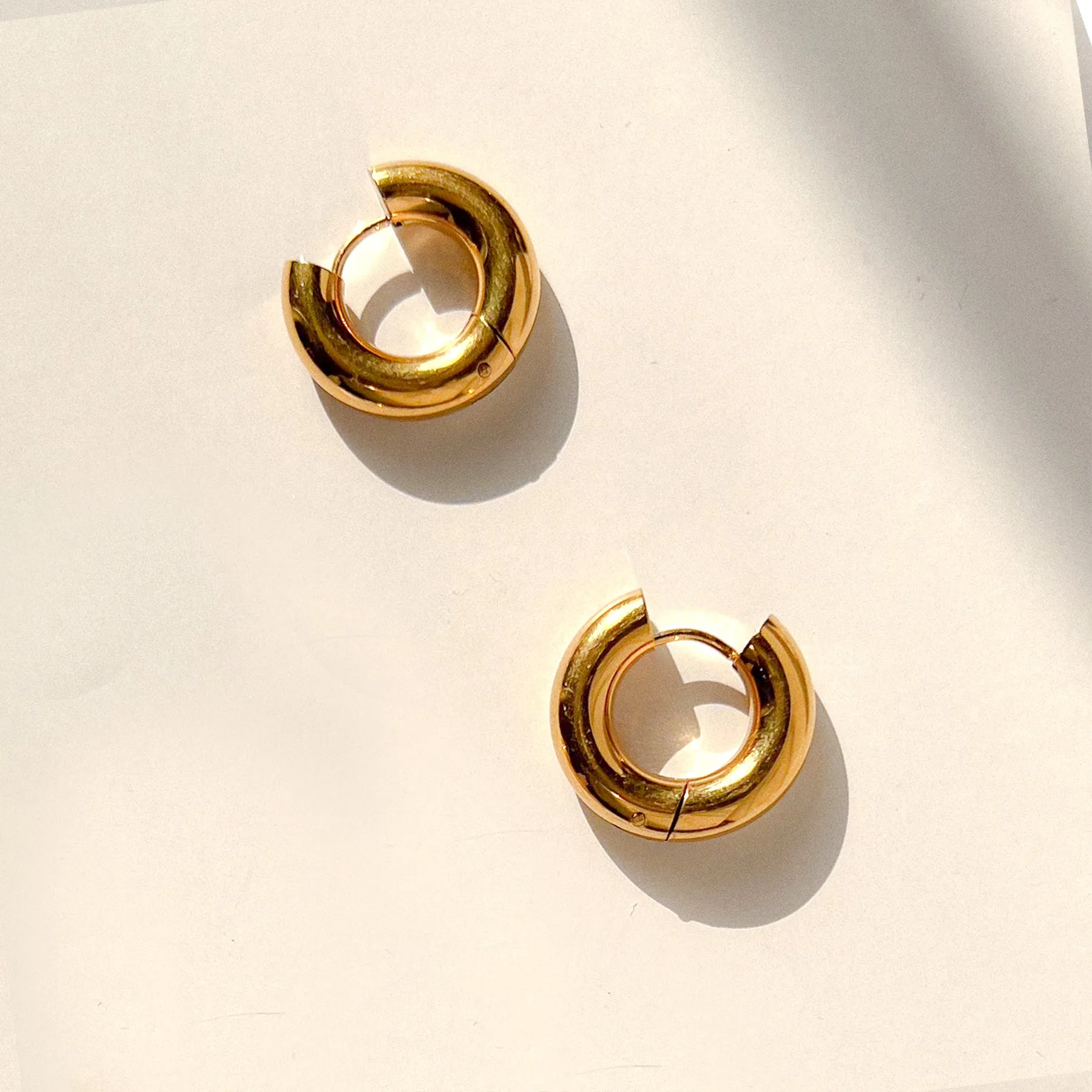 Chunky Gold Huggie Hoops sold by Gather Brooklyn