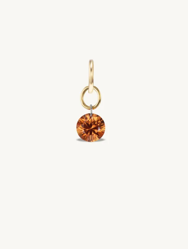 Small Round Pierced Orange Sapphire Charm for Chains sold by Sophie Ratner