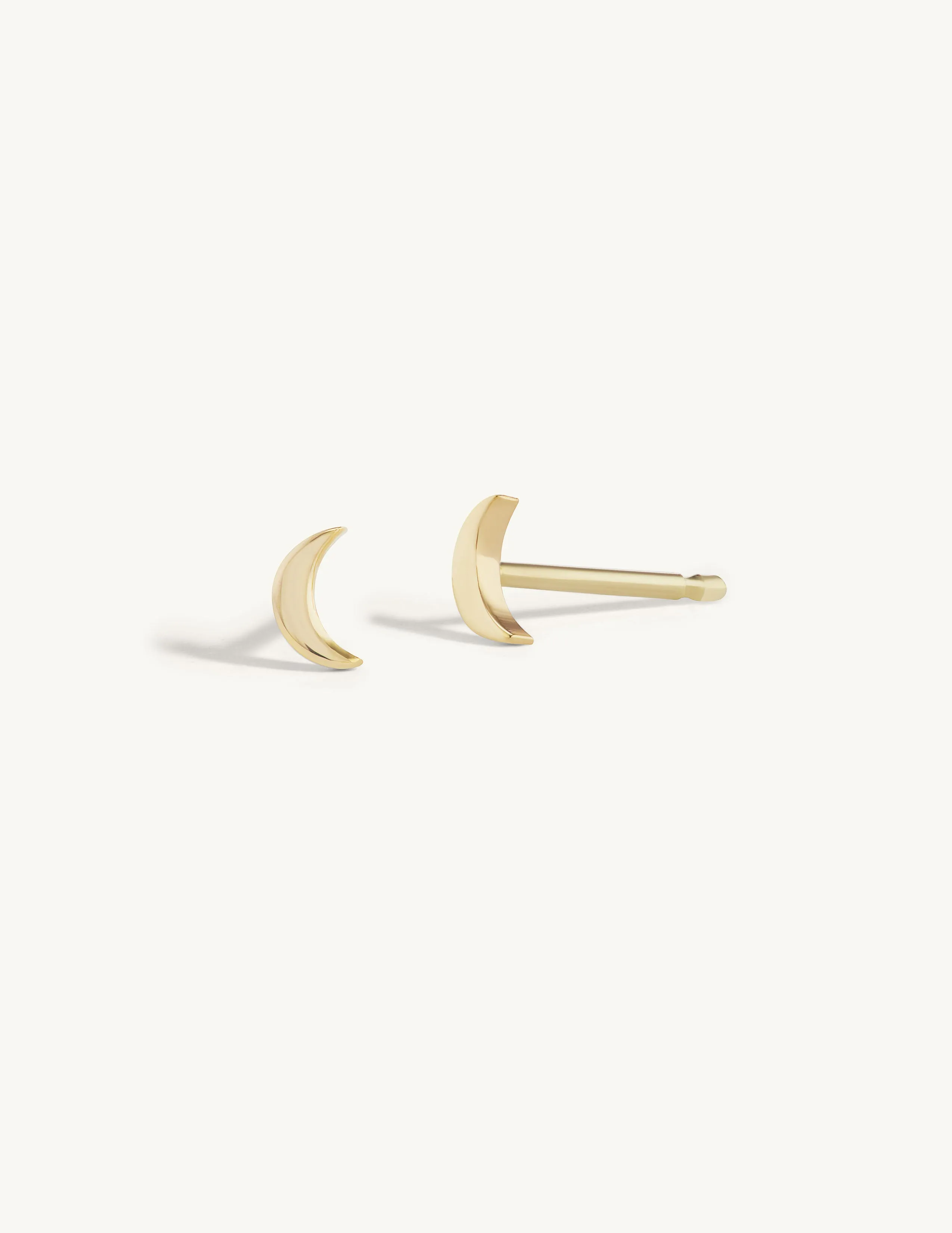 Solid Gold Moon Studs sold by Sophie Ratner