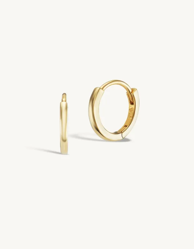 8mm Gold Huggies + Free Mini Round Diamond Charms sold by Sophie Ratner
