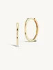 15mm Gold Huggies + Free Mini Round Pierced Diamond Charms sold by Sophie Ratner