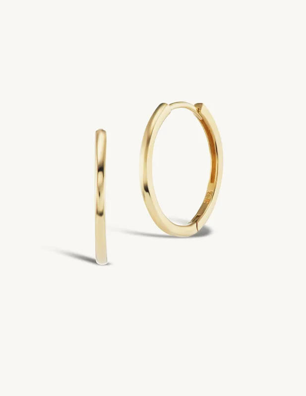 15mm Gold Huggies + Free Mini Round Pierced Diamond Charms sold by Sophie Ratner