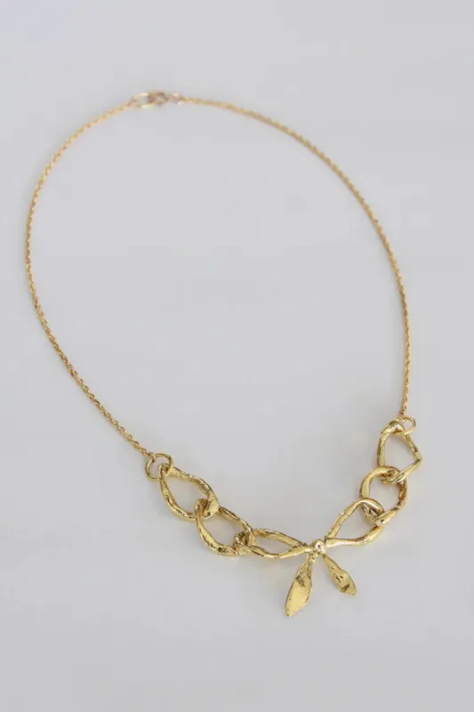 ORAC Bow Realis Golden Necklace made by Eliza Faulkner