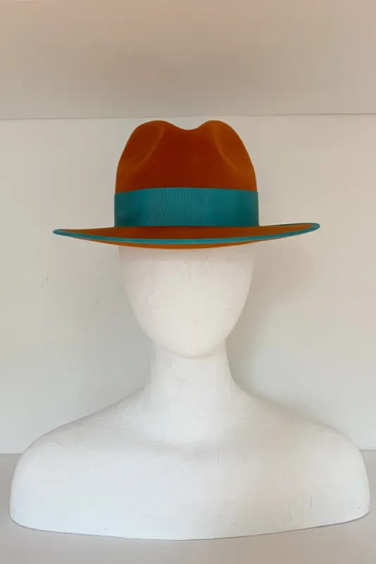 Burnt orange fedora with teal grosgrain (SIZE SMALL) sold by Heirloom Hats