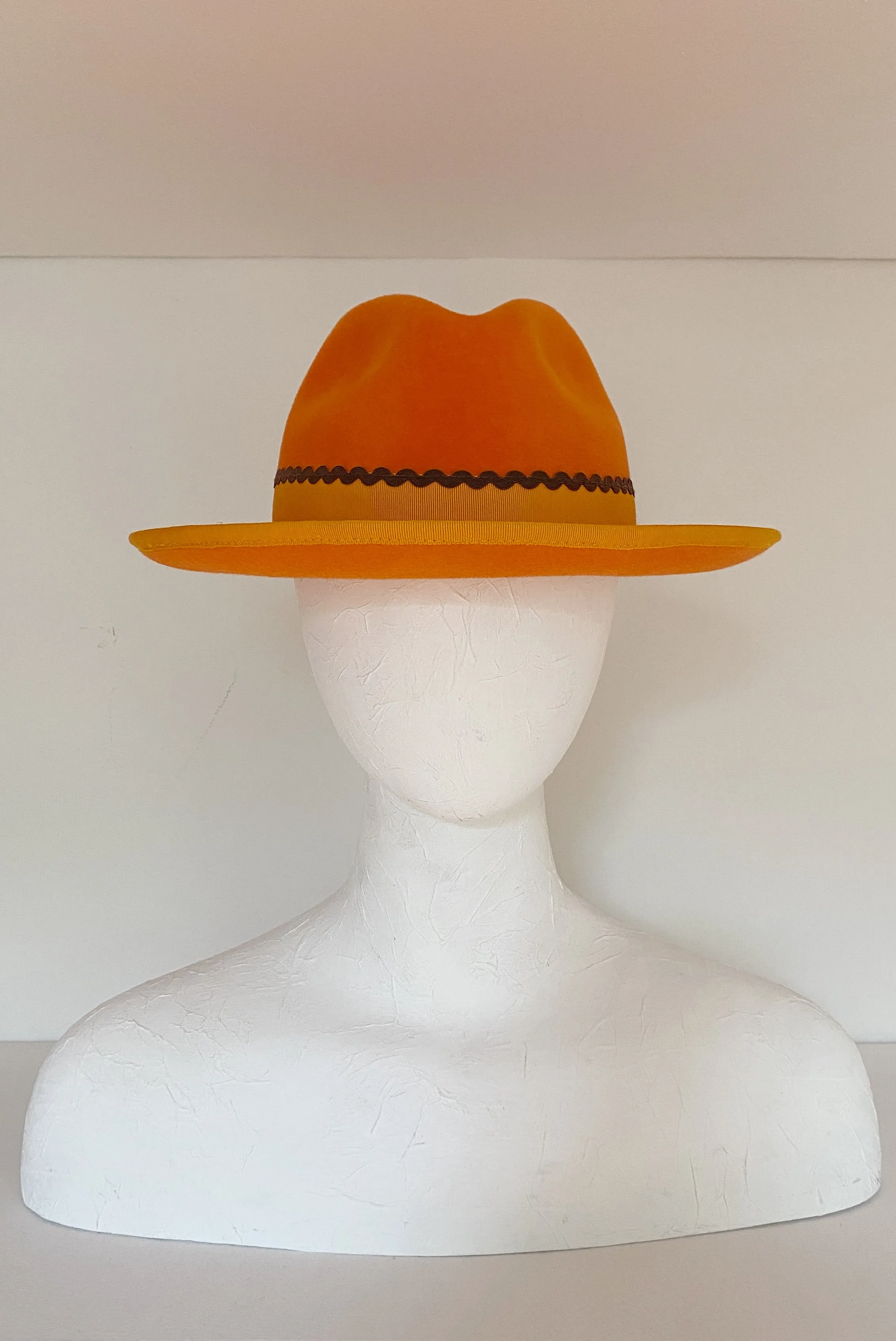 Bright orange fedora with orange grosgrain and brown ricrac (SIZE LARGE) sold by Heirloom Hats