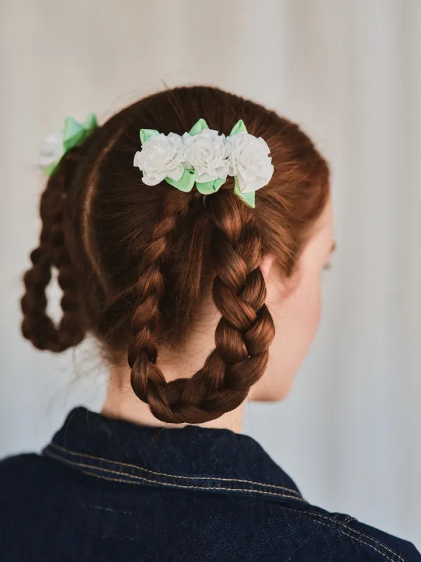White carnation hair clip sold by Heirloom Hats