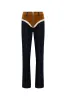 JESSI - Color-block jeans with ruffle detail sold by Siedres