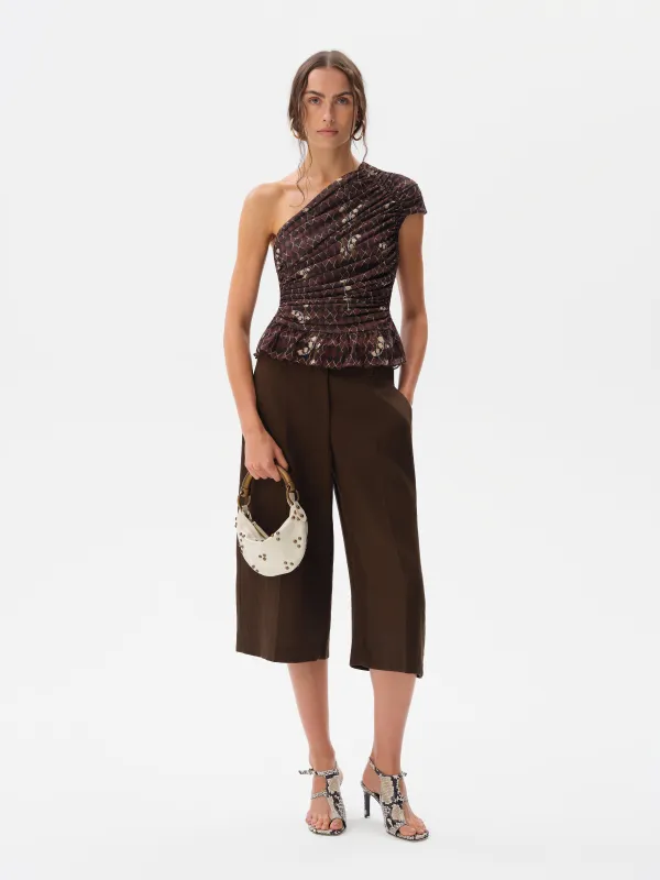 OPHI - One-shoulder printed mesh top sold by Siedres