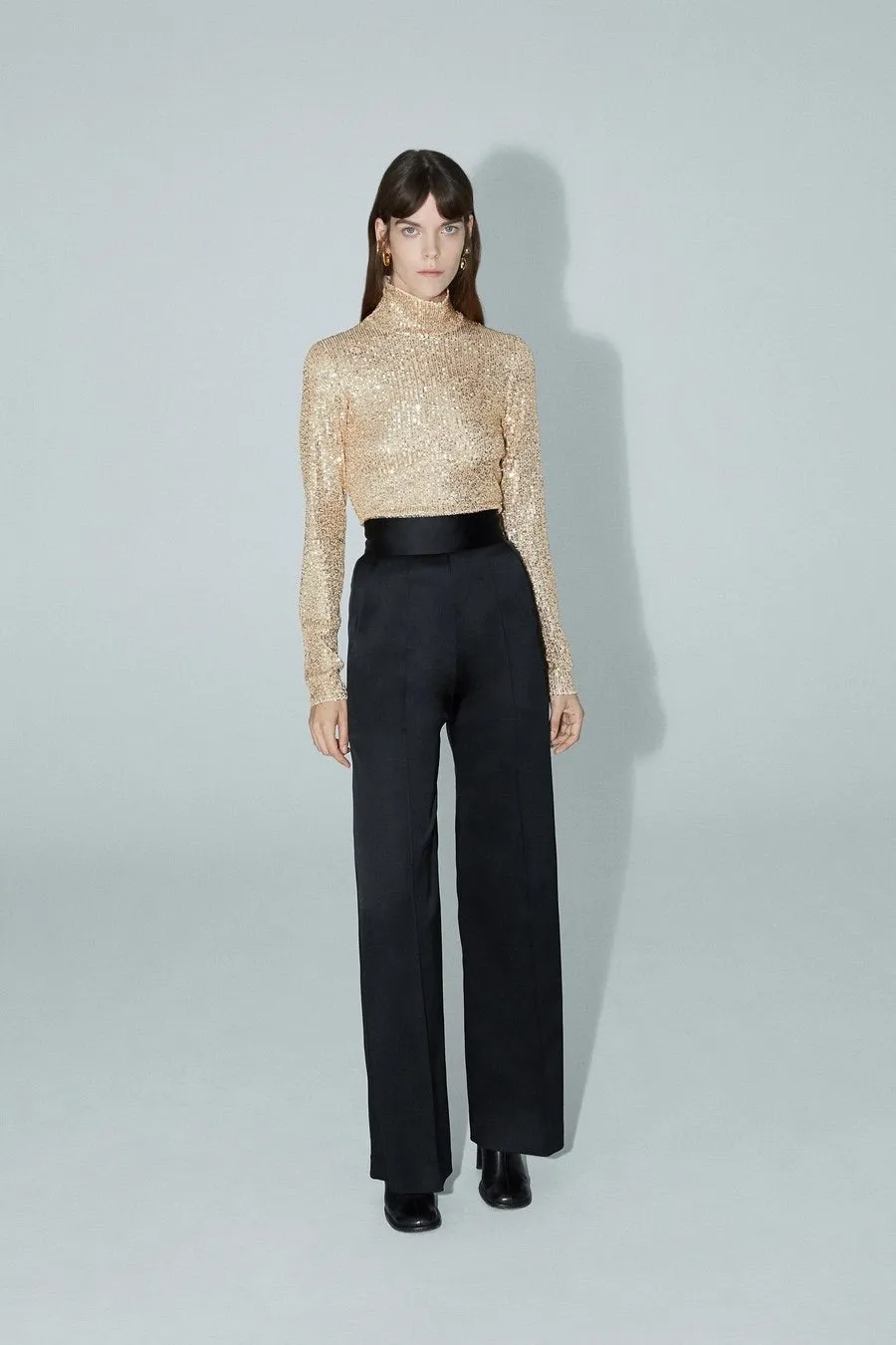 Sequins mock neck sold by Sid Neigum