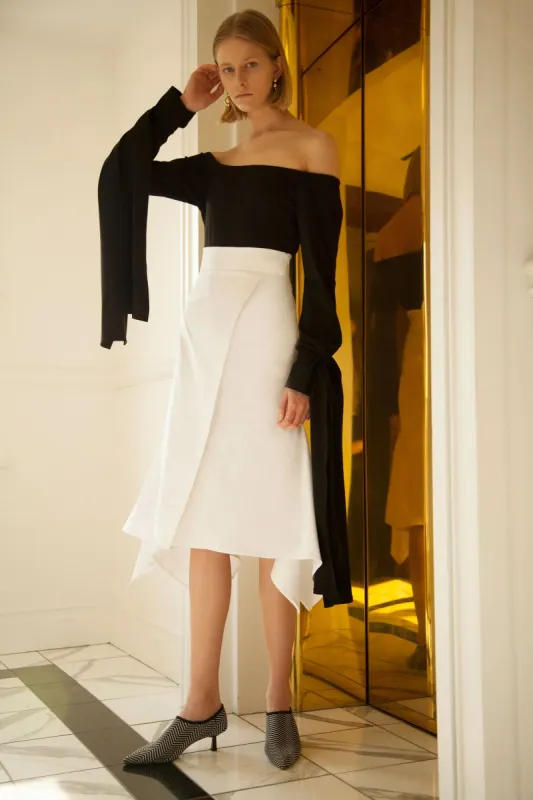 Off shoulder wrap sleeve top sold by Sid Neigum