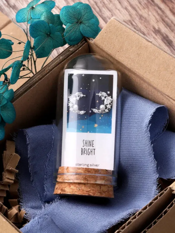 Attic Creations Crystal And Pearl Moon Earrings sold by Coes