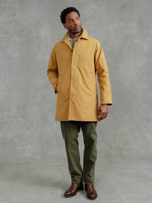 The Ventile® Raglan Raincoat - Yellow Ochre sold by Private White V.C.