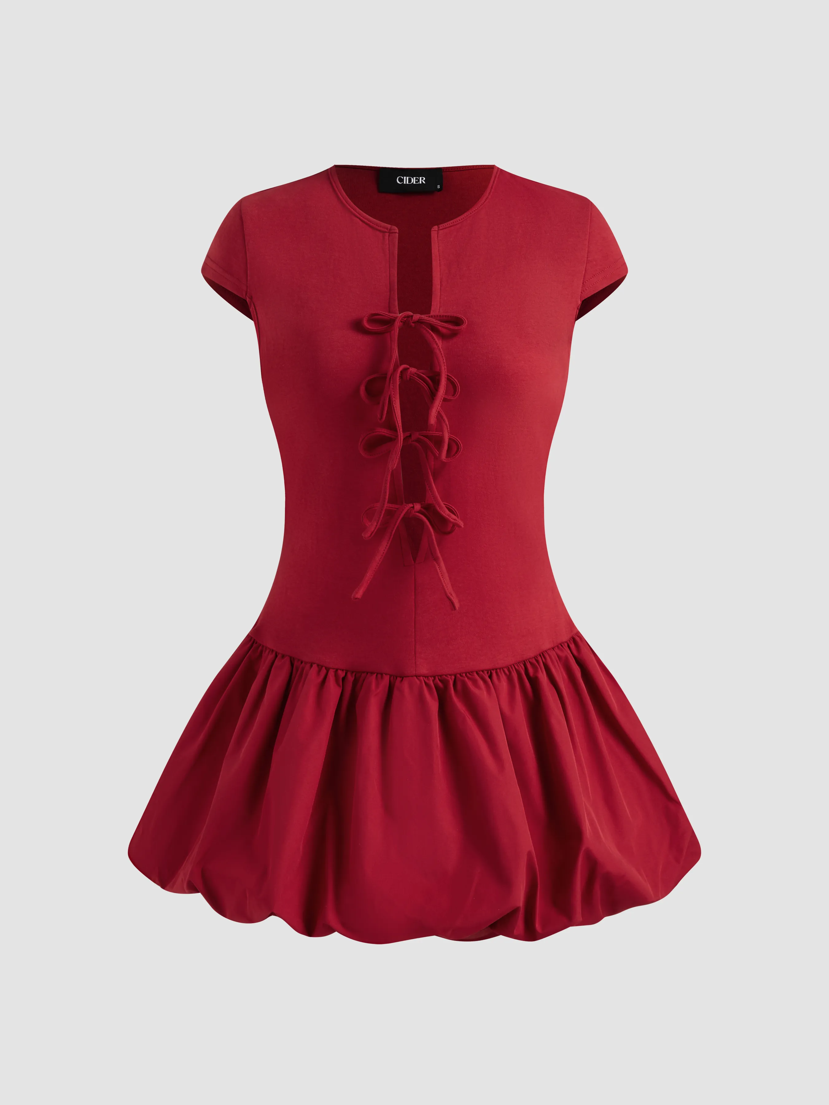 Cotton-blend Round Neckline Solid Tie Front Bubble Hem Mini Dress sold by Cider