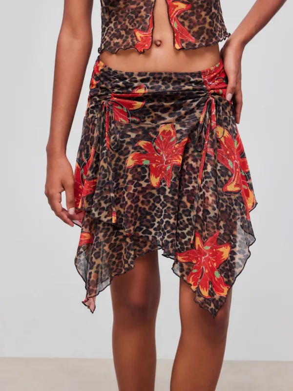 Mid Rise Leopard Floral Drawstring Asymmetric Hem Mini Skirt sold by Cider