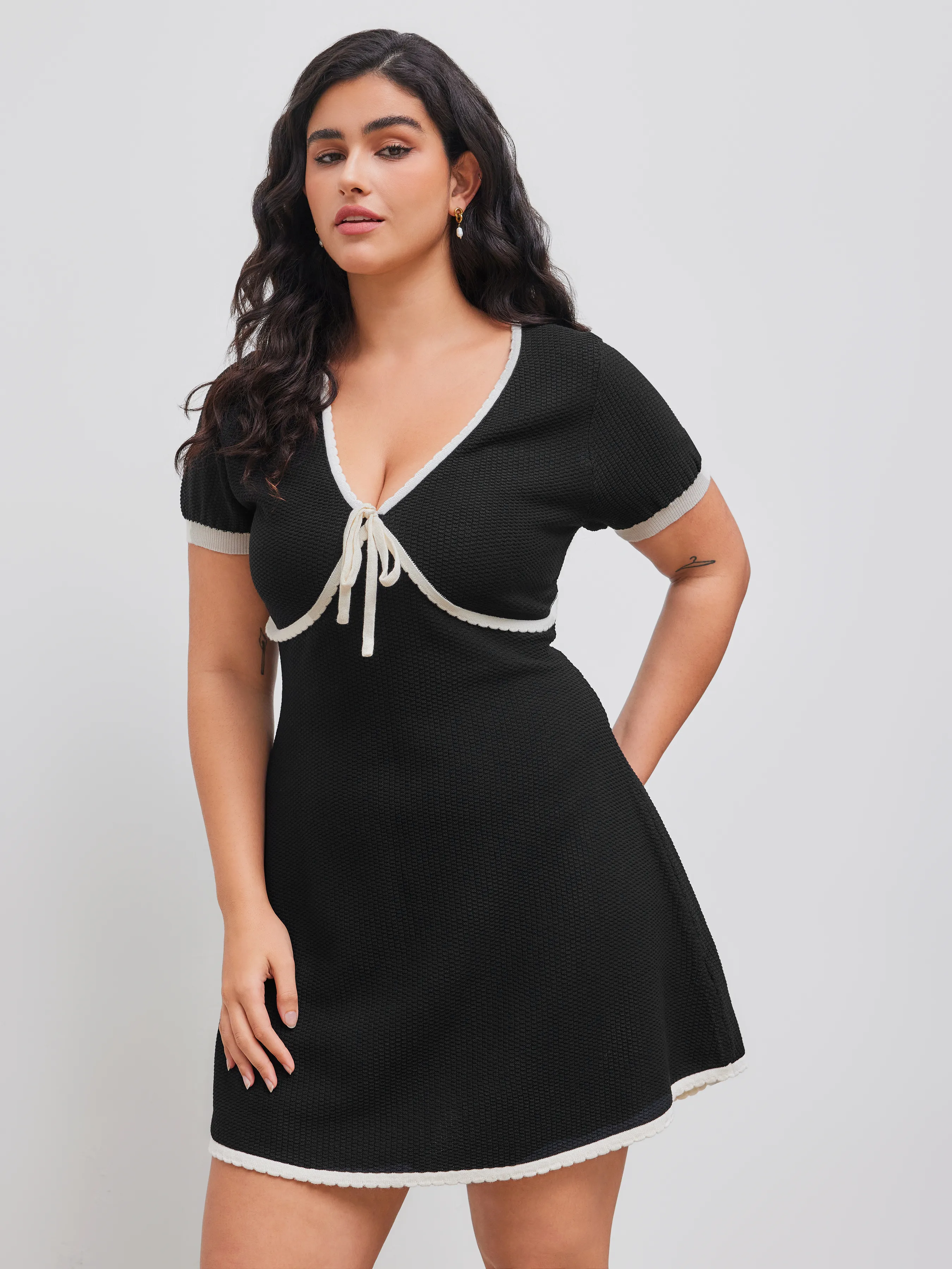 Knitted V-neck Solid Knotted Contrasting Binding Mini Dress Curve & Plus sold by Cider