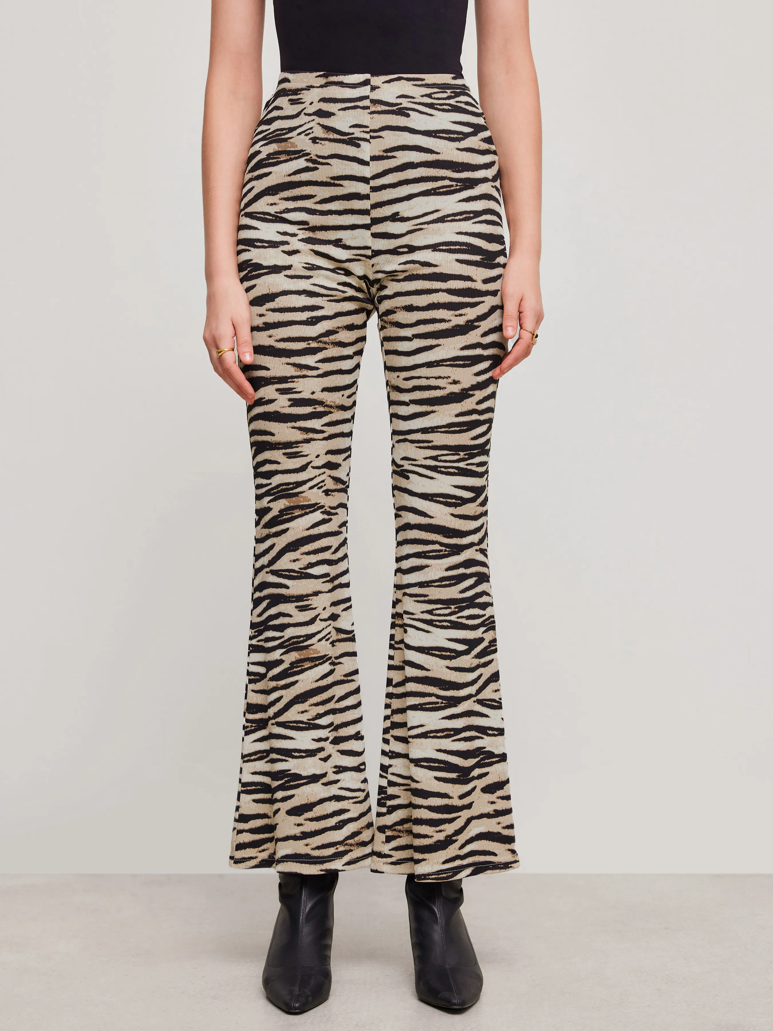 Mid Rise Zebra Stripe Flared Trousers sold by Cider