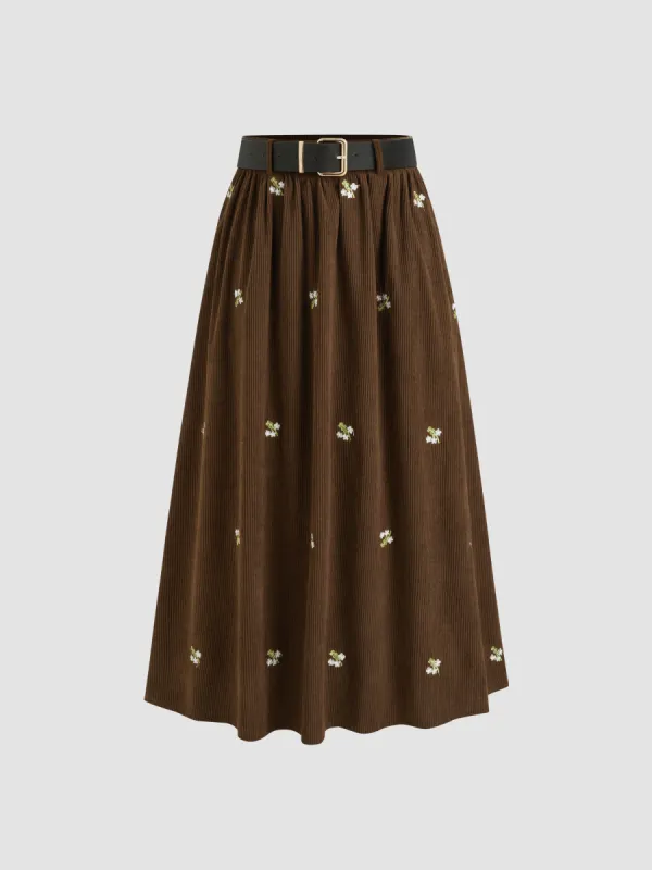 Corduroy Mid Rise Floral Embroidery Ruffle Pocket Maxi Skirt With Belt sold by Cider