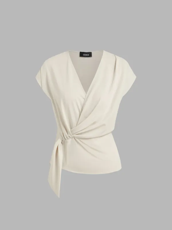 Woven V-neck Solid Wrap Short Sleeve Blouse sold by Cider